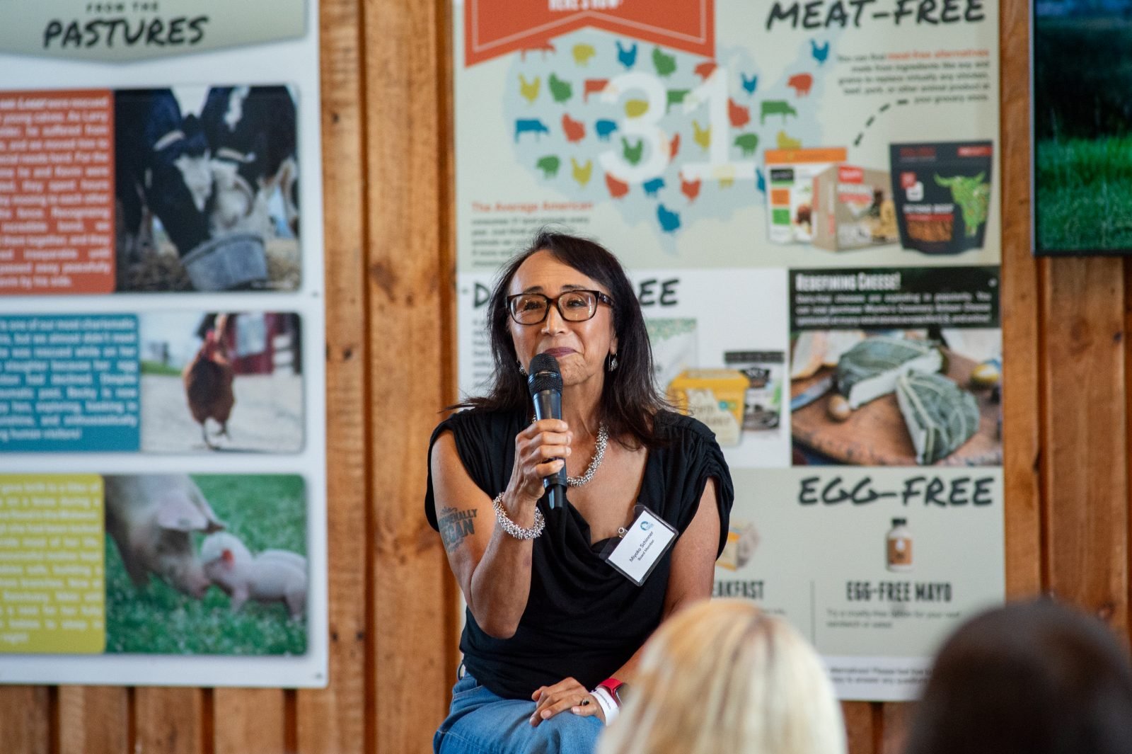 Miyoko Schinner holds microphone during Q&A at Farm Sanctuary's Hoedown 2025 event