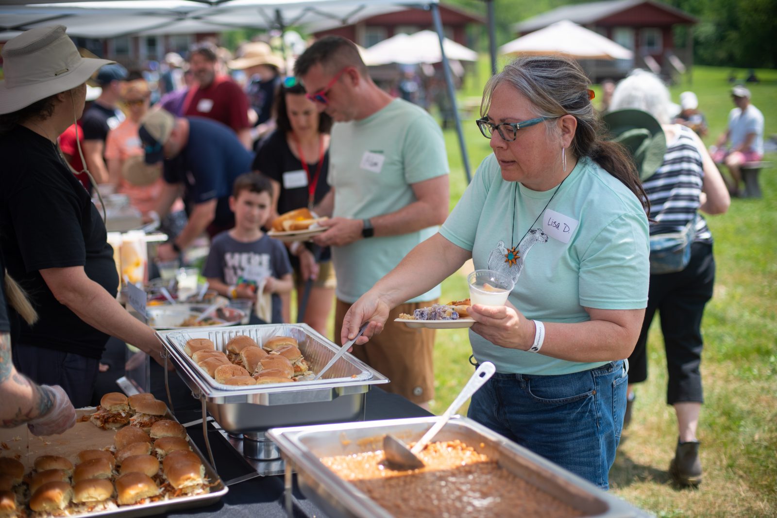 Vegan food being served to guests at Farm Sanctuary event