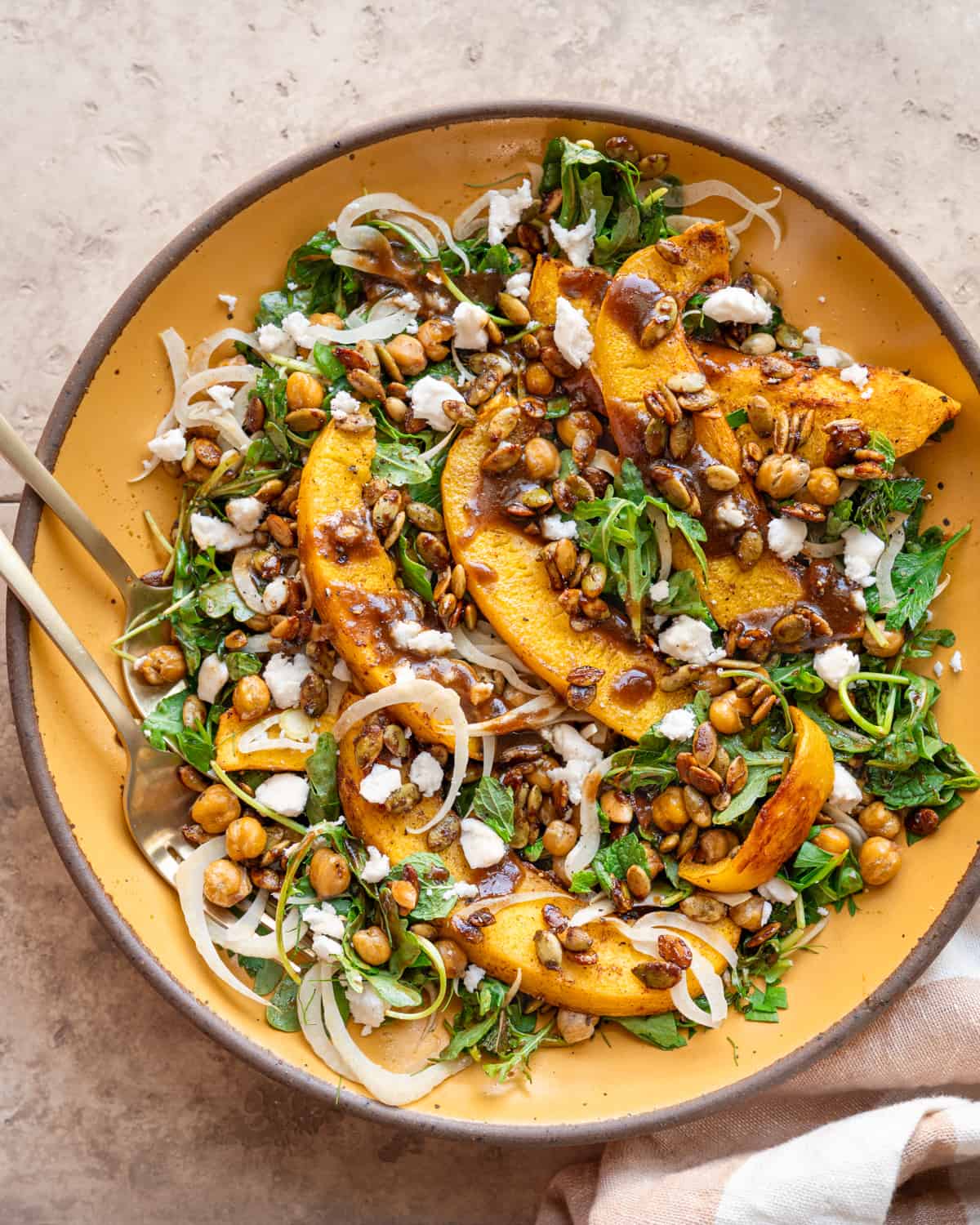 Bowl of roasted pumpkin salad by Rainbow Plant Life Bowl of roasted pumpkin salad by Rainbow Plant Life