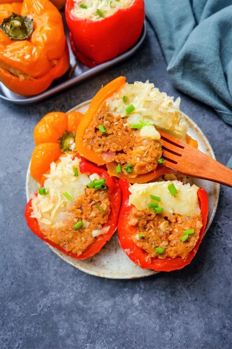 Plate of vegan meatball and mashed potato stuffed peppers by The Foodie Takes Flight Plate of vegan meatball and mashed potato stuffed peppers by The Foodie Takes Flight