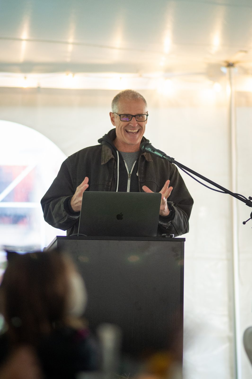 Gene Baur speaks at podium at Farm Sanctuary's Celebration for the Turkeys event 2025
