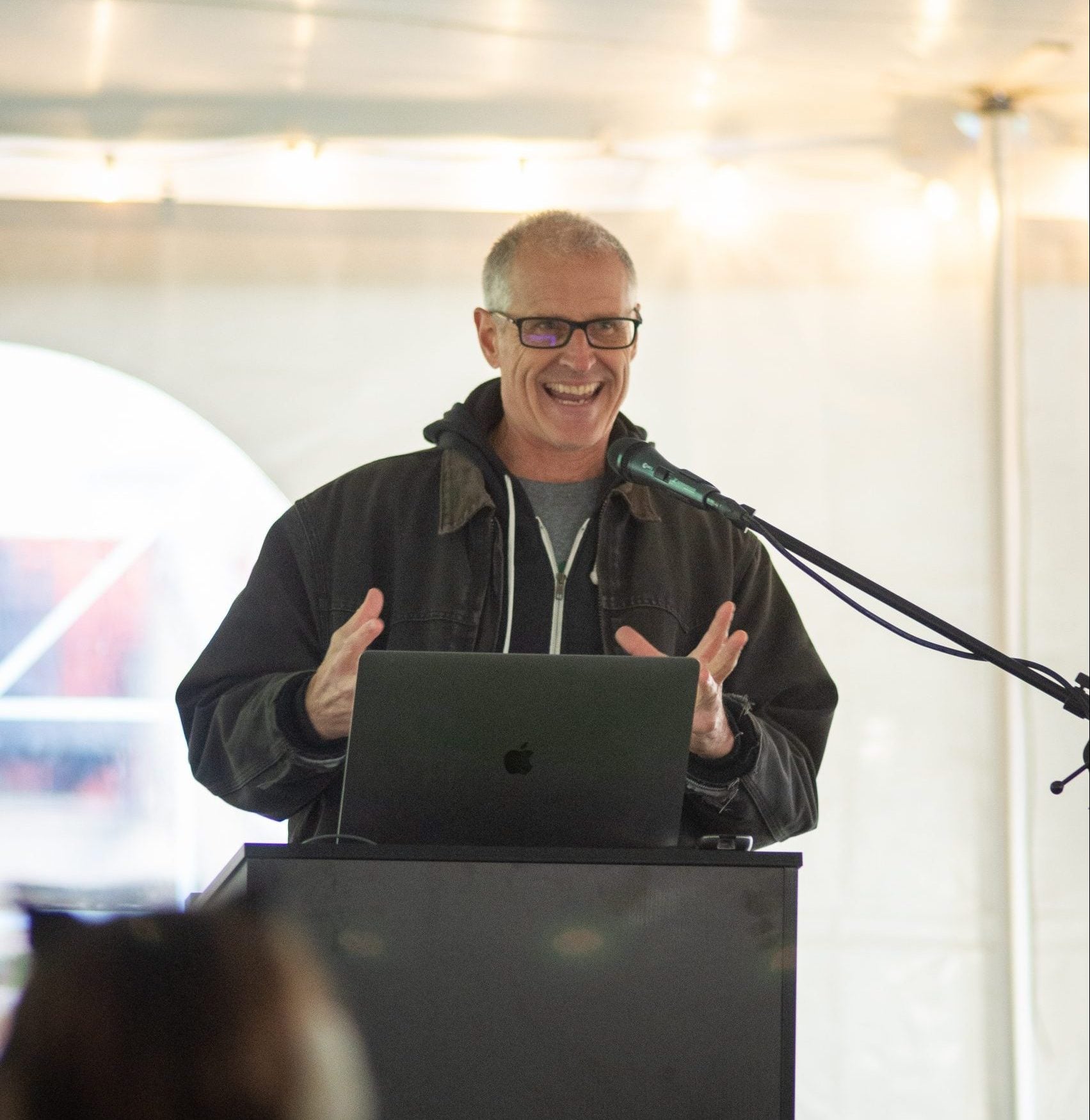 Gene Baur speaks at podium at Farm Sanctuary's Celebration for the Turkeys event 2025