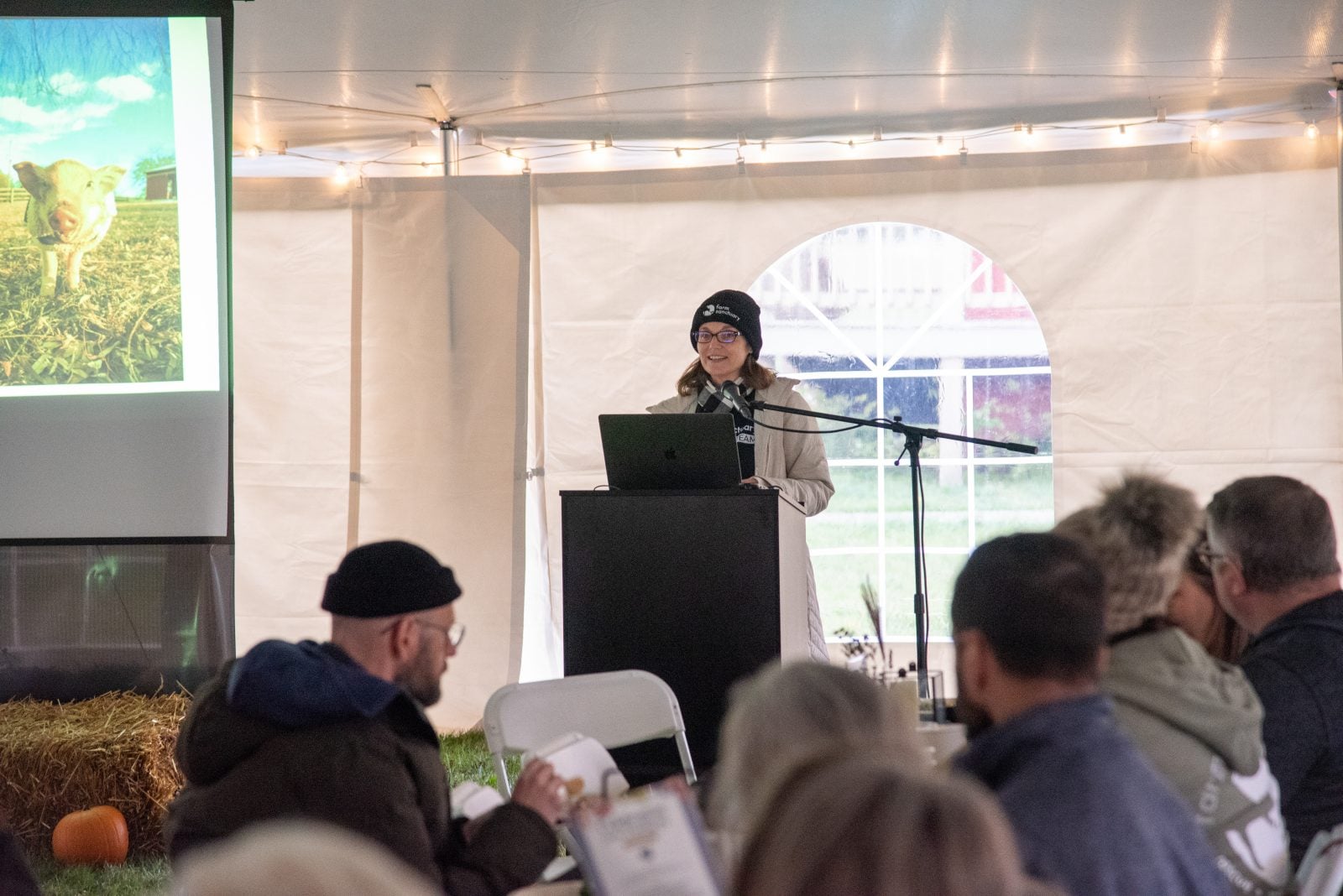 Mercy Mize speaks to guests at podium at Farm Sanctuary's Celebration for the Turkeys event 2025