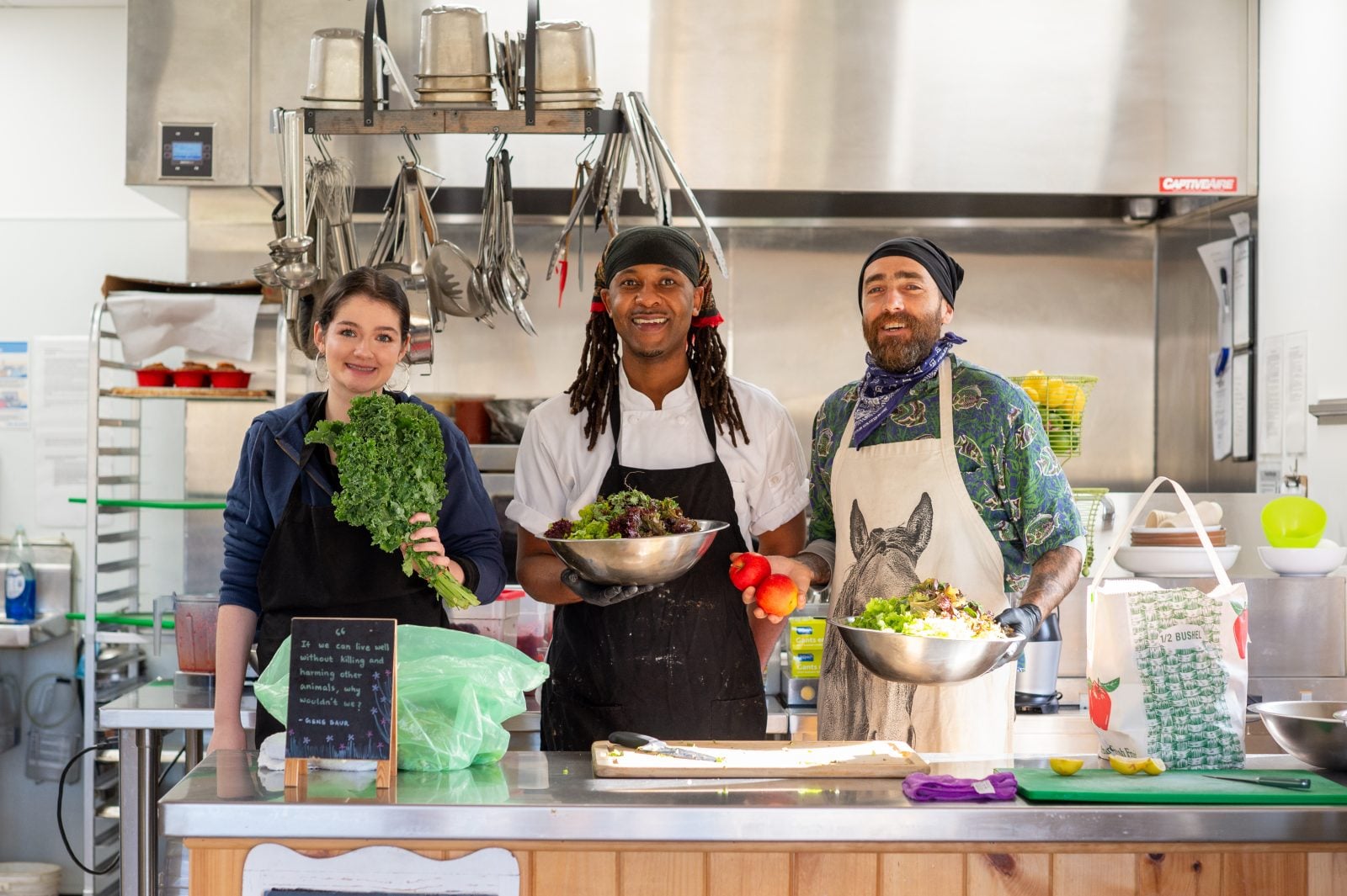 Three staff at The Kitchen at Farm Sanctuary