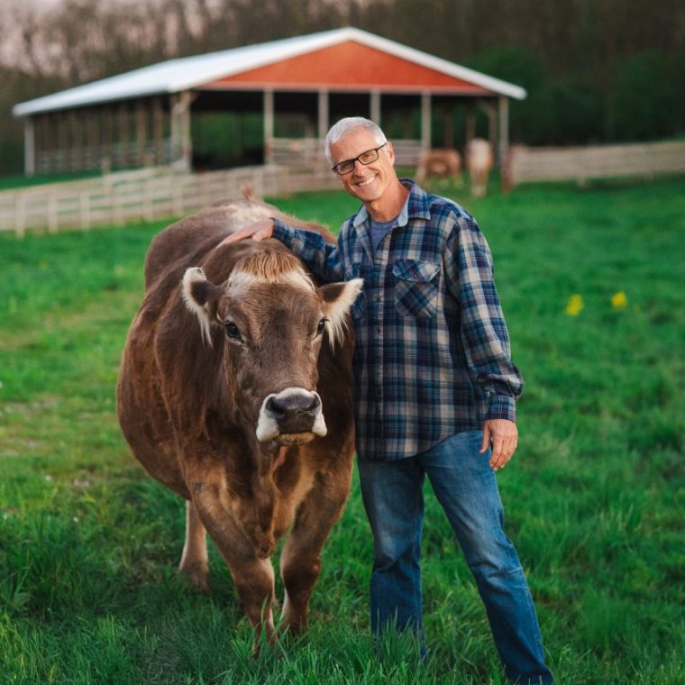 Gene Baur with Honey cow